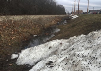 Some snow near the railroad tracks hangs on as temperatures rise in a oddly warm February.